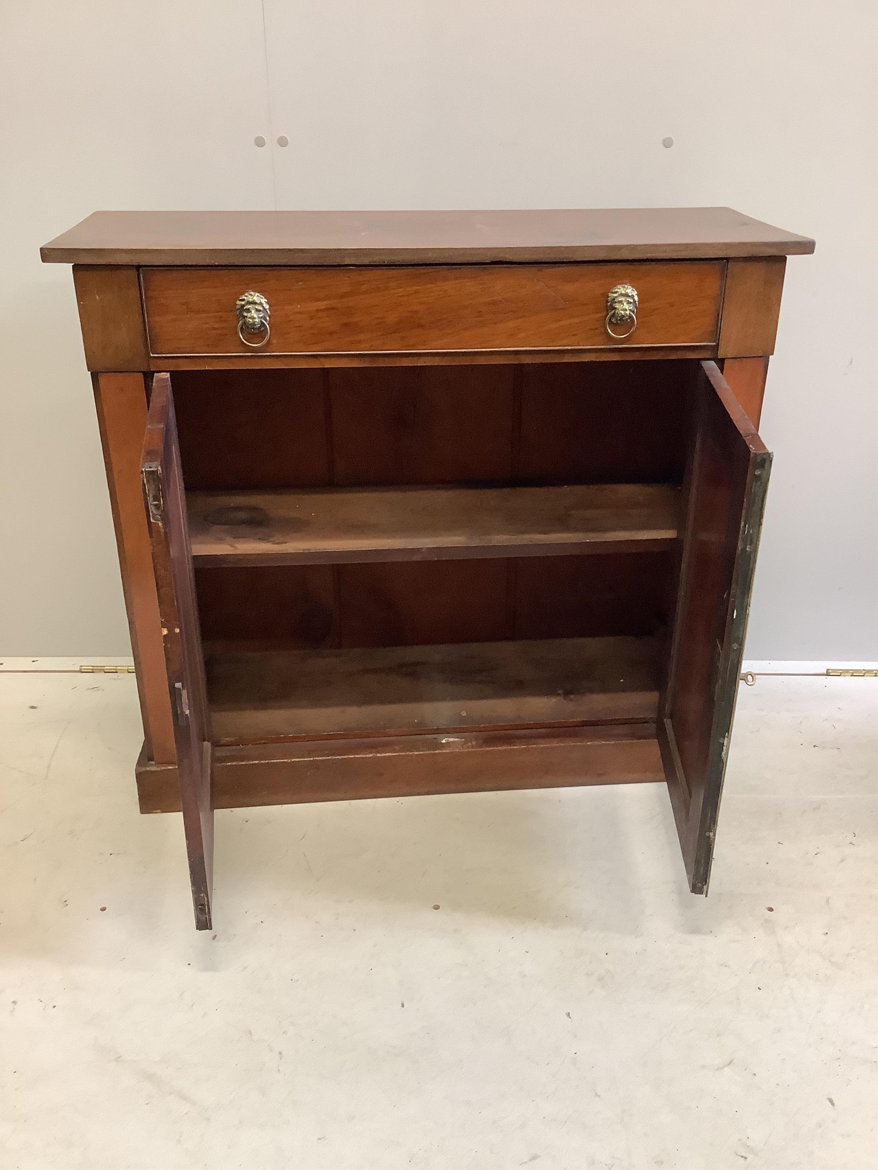 A Regency style mahogany side cabinet, fitted one long drawer over panelled cupboard, width 91cm, depth 32cm, height 80cm. Condition - poor